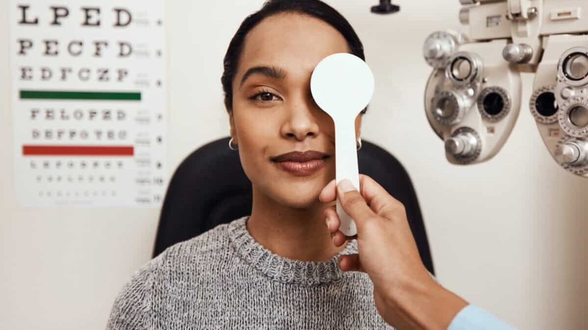 patient tests her eyes with a vision test at a doctor