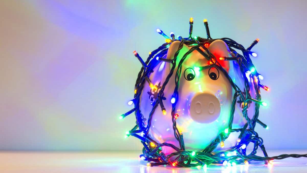 Piggy bank wrapped in Christmas string lights